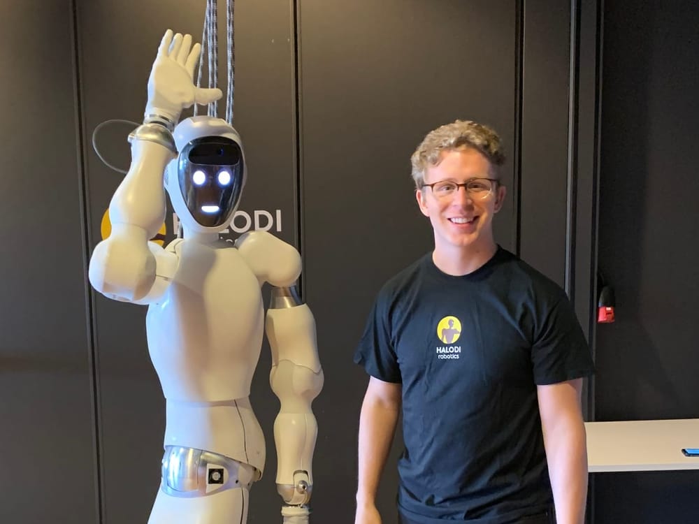 Audrow Nash with Eve, the humanoid robot